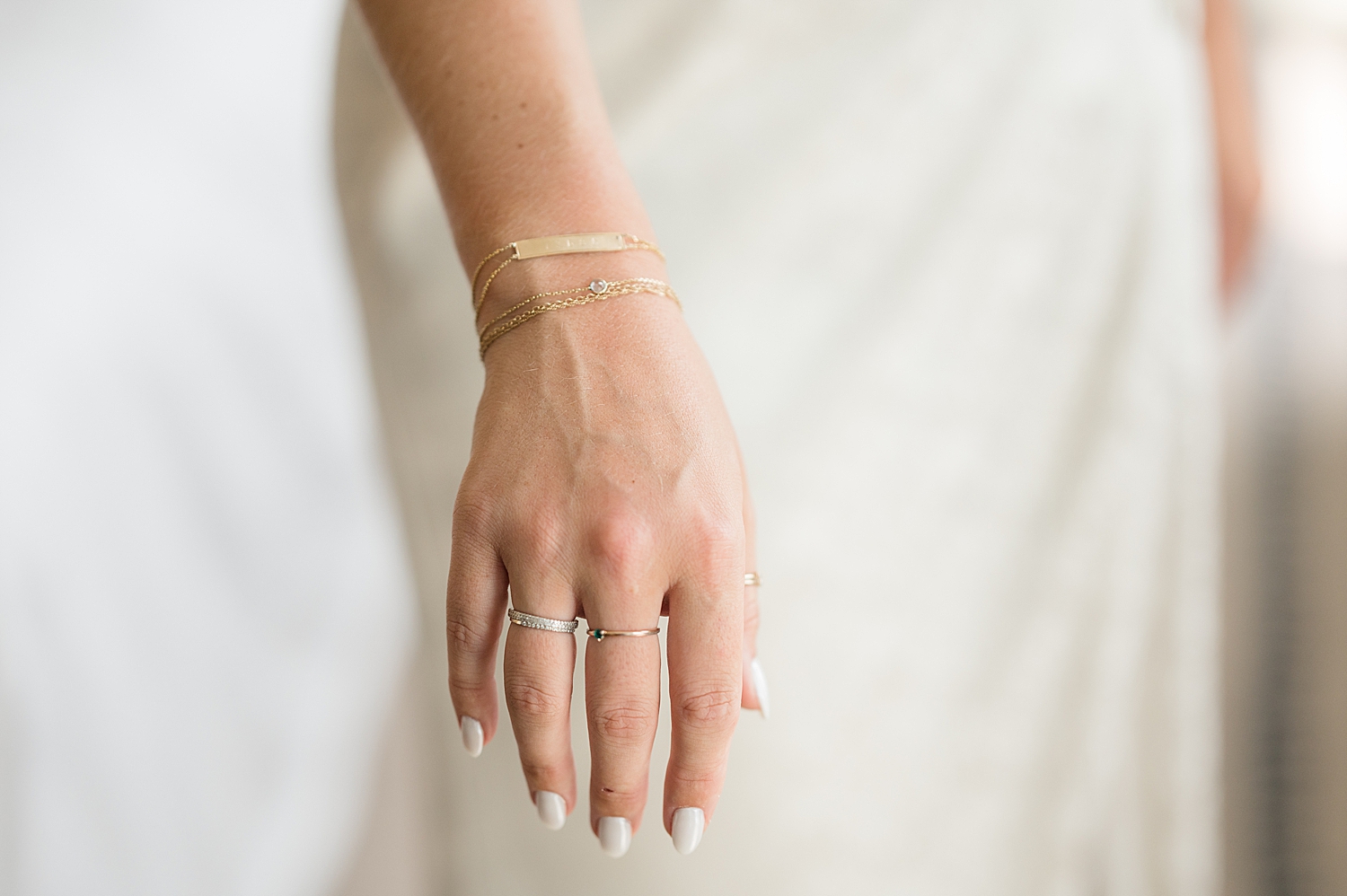 close up of bride's jewelry