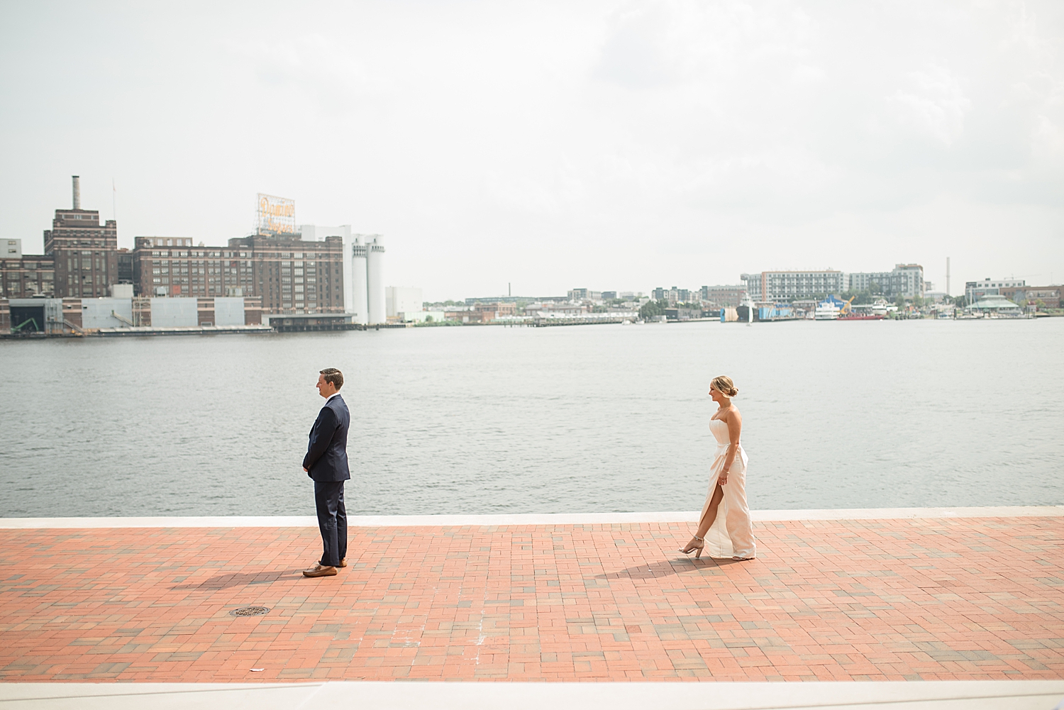 bride and groom first look baltimore harbor