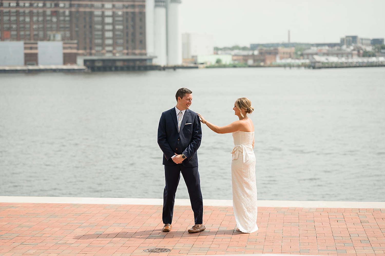 bride and groom first look baltimore harbor