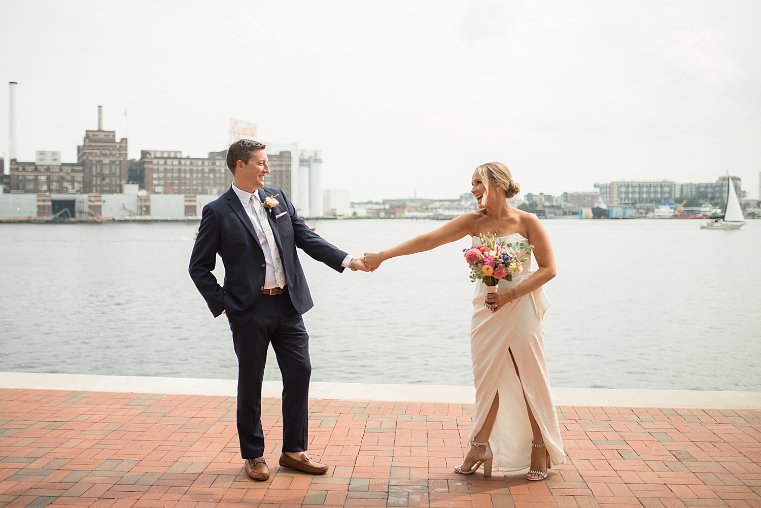 bride and groom first look baltimore harbor