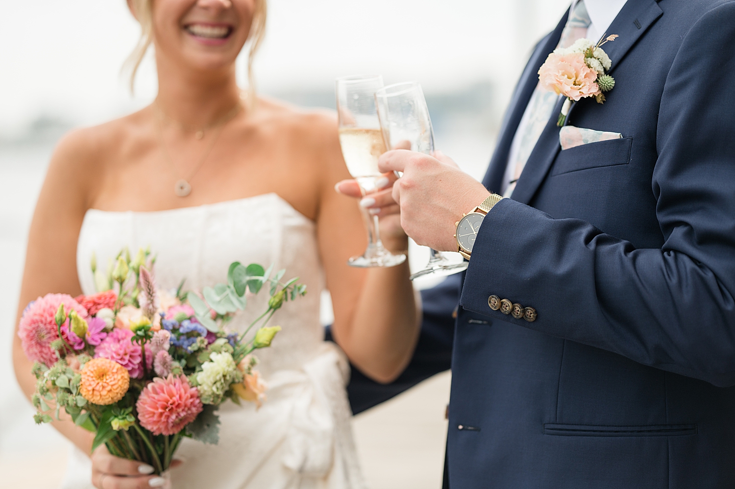 bride and groom toast with champagne