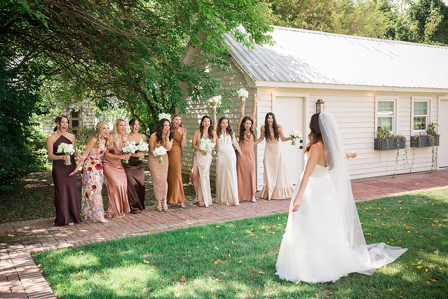 bride reveals final look to bridesmaids