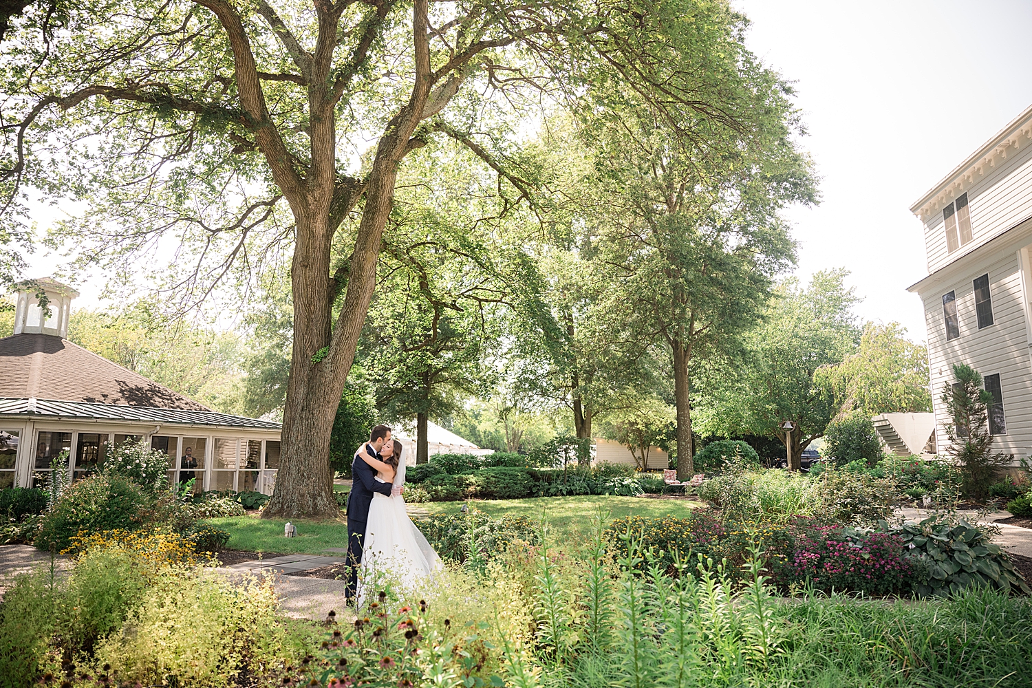 glowy greenery couple portrait on wedding day