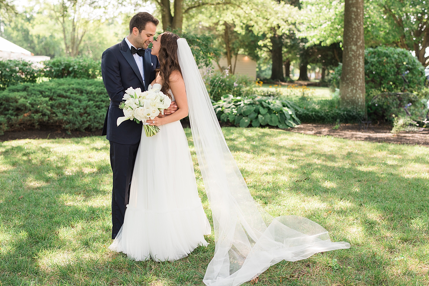 glowy greenery couple portrait on wedding day