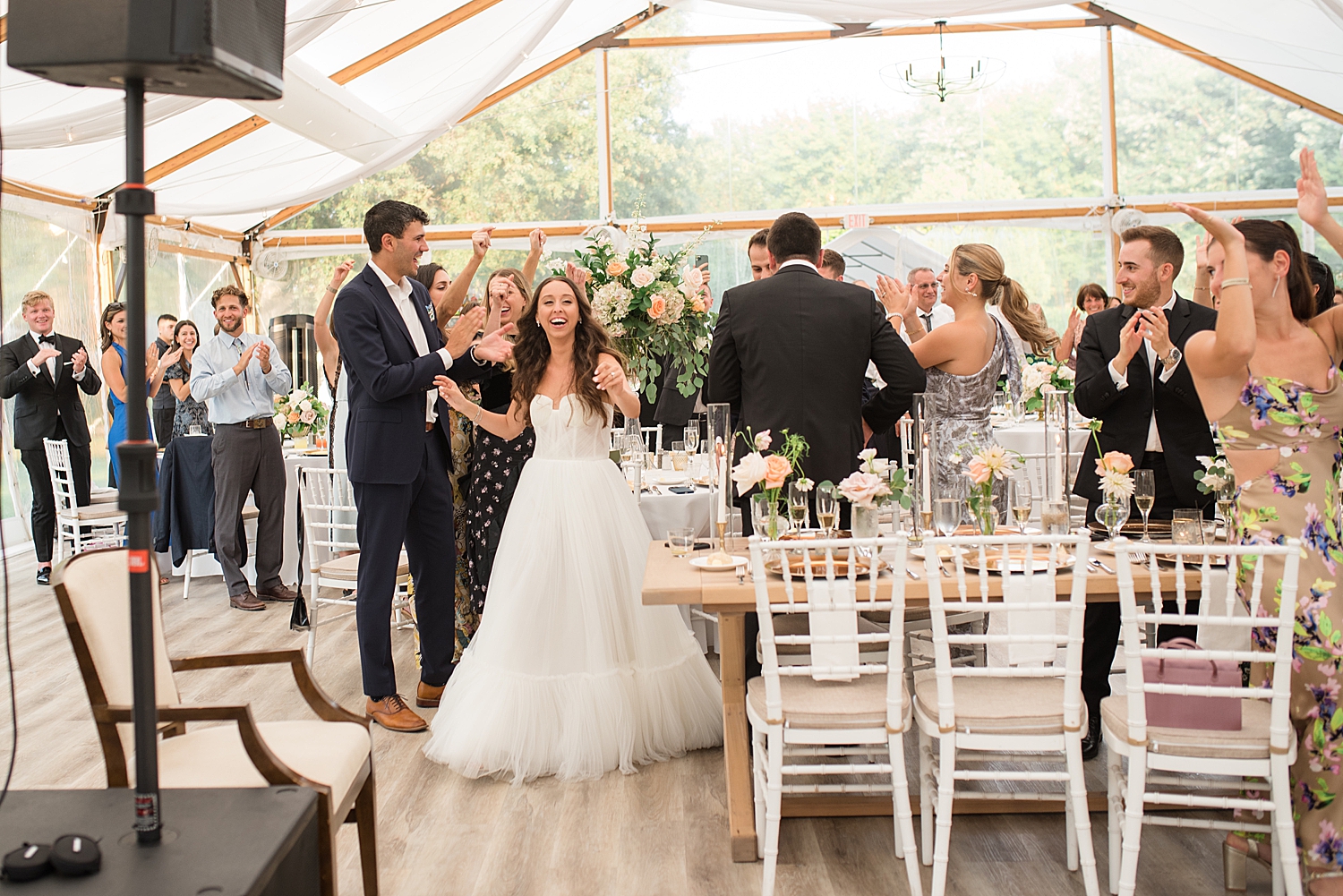 bride and groom enter reception