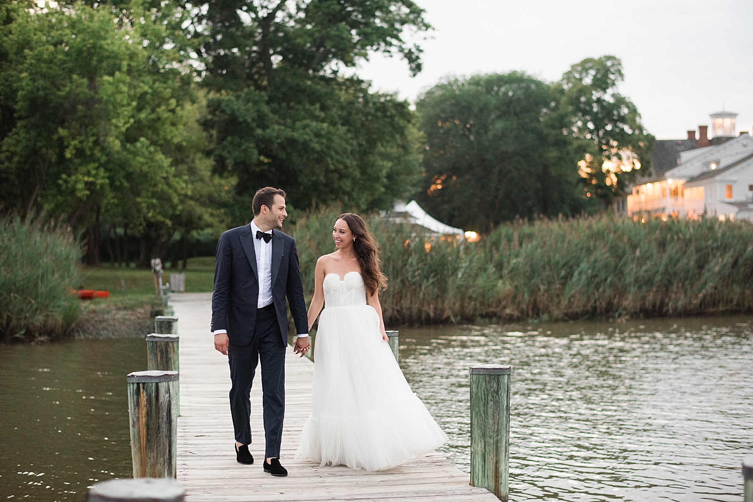 bride and groom portrait on pier