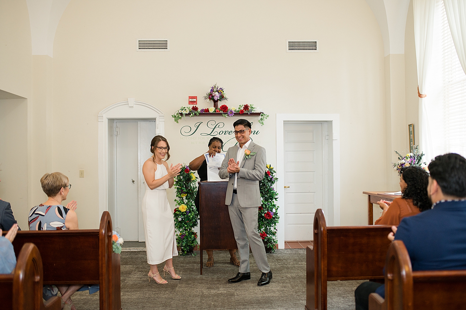 bride and groom celebrate after first kiss