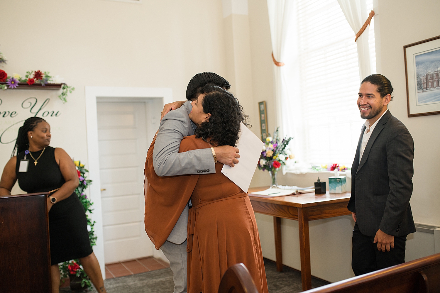 groom hugs family