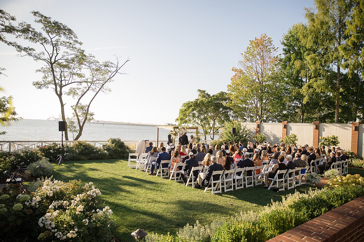 wide shot of ceremony at chesapeake bay beach club lawn