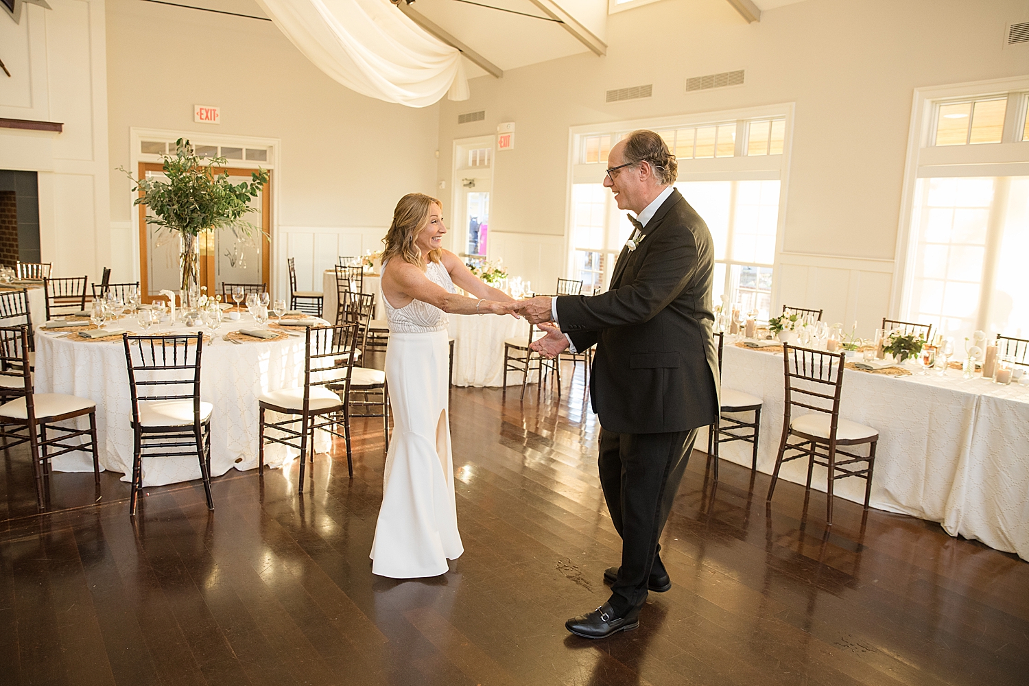 bride and groom practice first dance