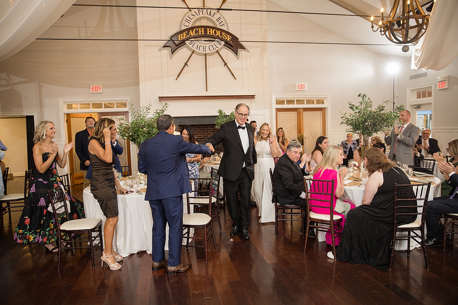 bride and groom enter ballroom reception