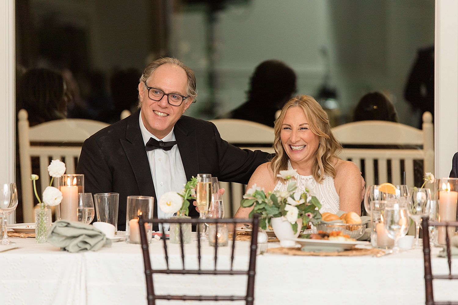 bride and groom react to wedding speeches