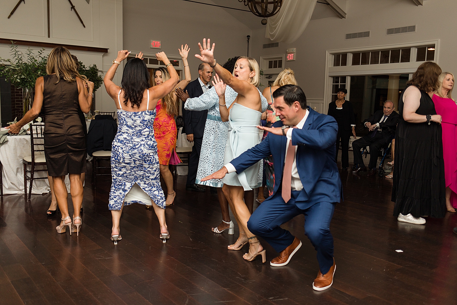 candid wedding guests dancing