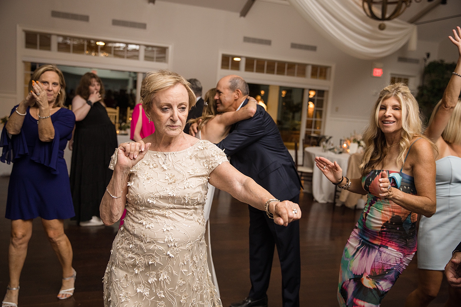 candid wedding guests dancing