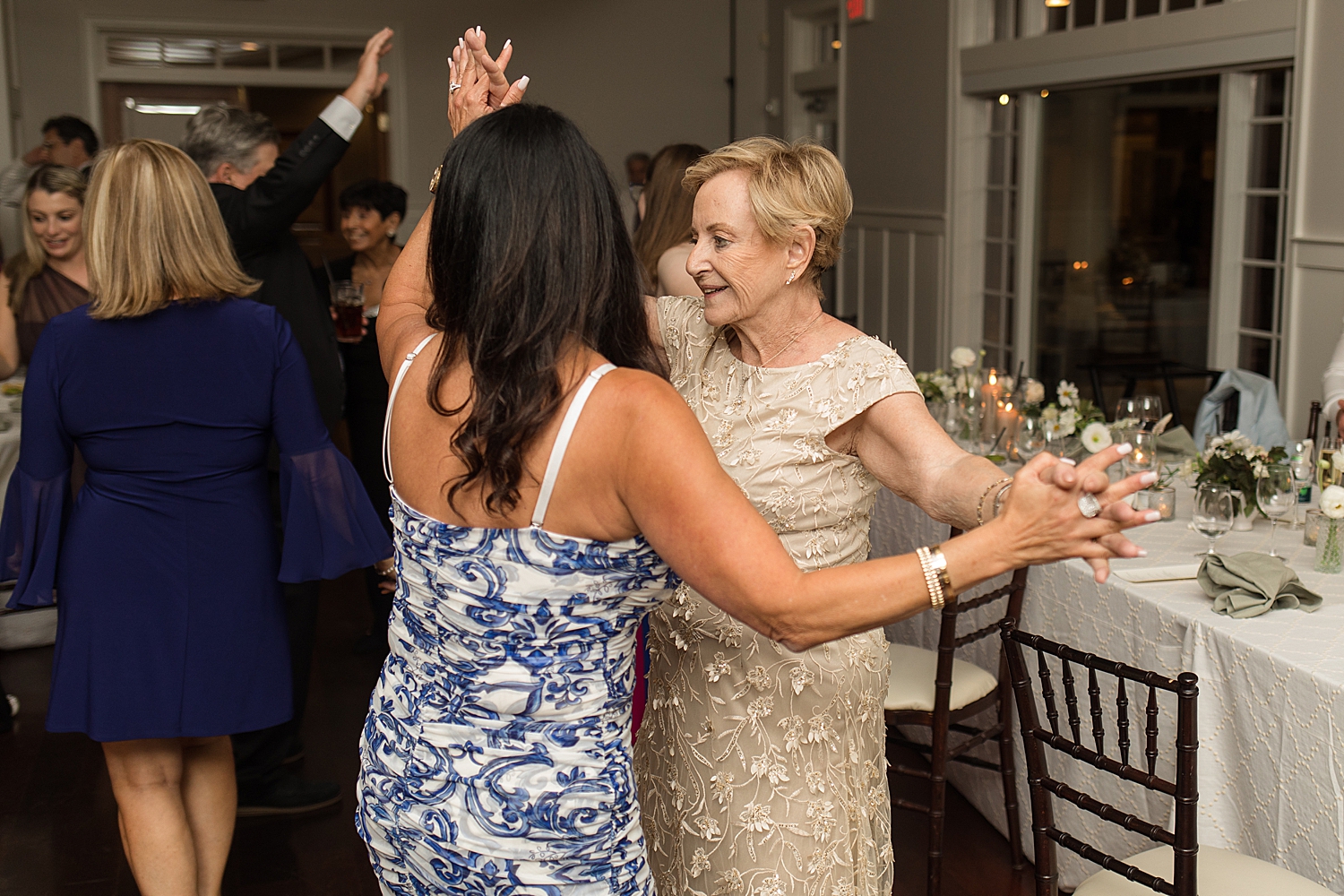 candid wedding guests dancing