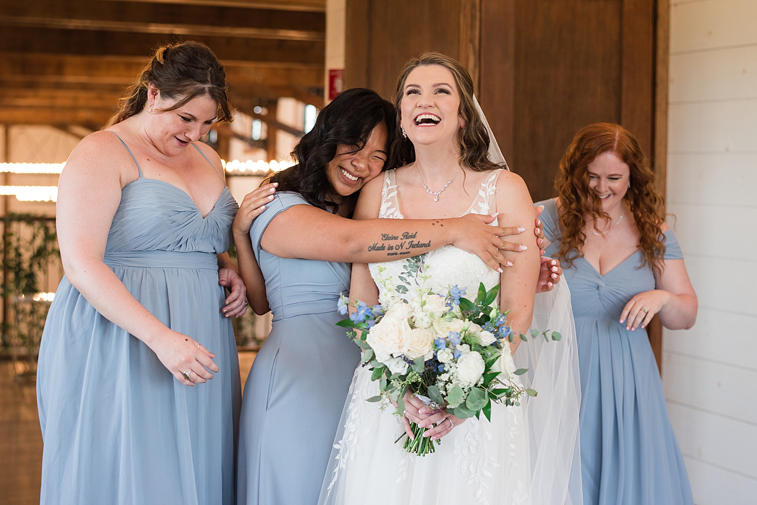 bridesmaids hug bride