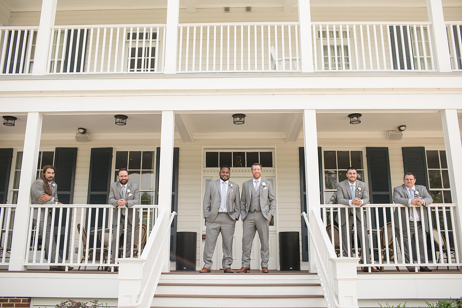 groomsmen photo on kent island resort deck