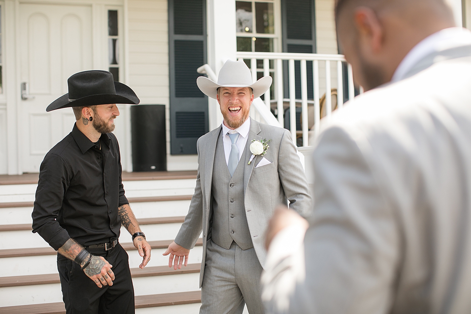 candid shot of groom hanging out with friends