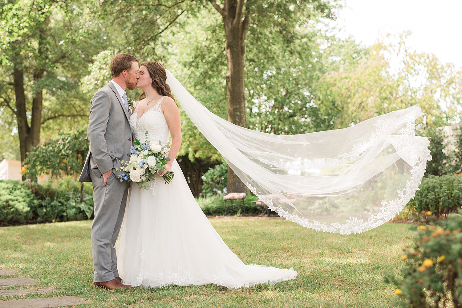 couple portrait veil toss