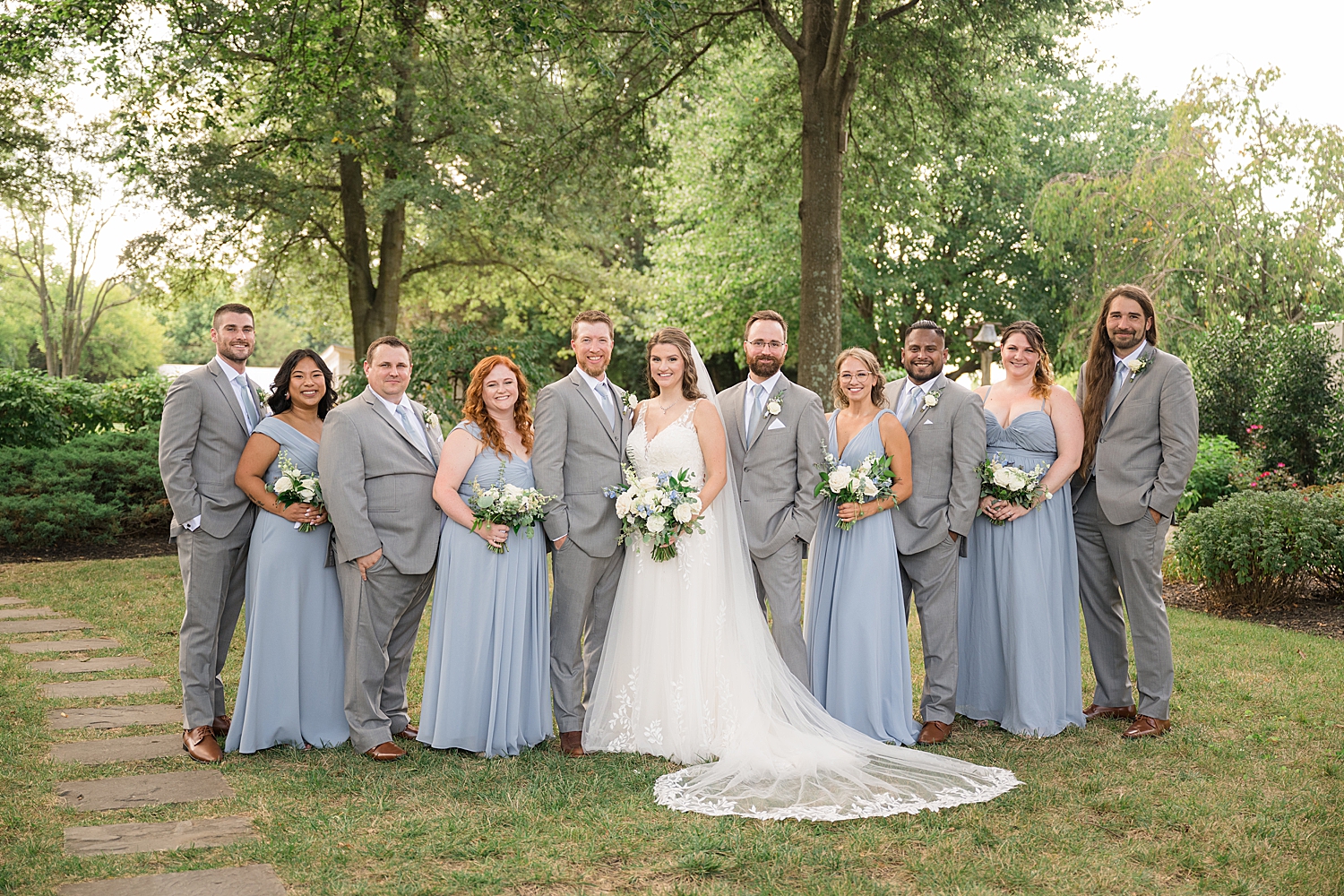 bride and groom with full wedding party