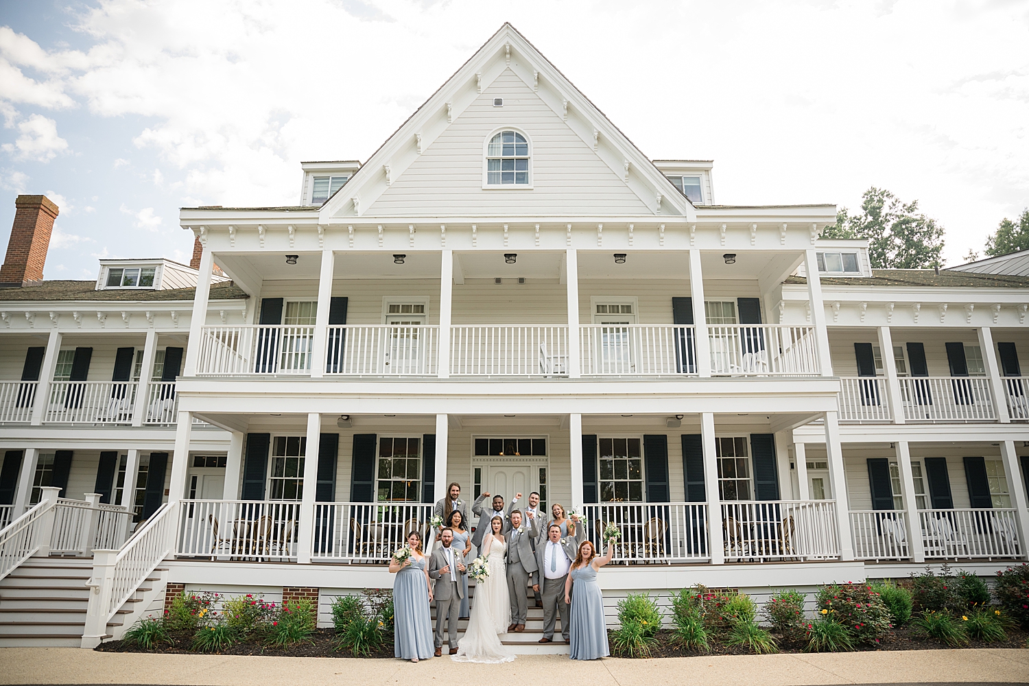 full wedding party in front of kent island resort