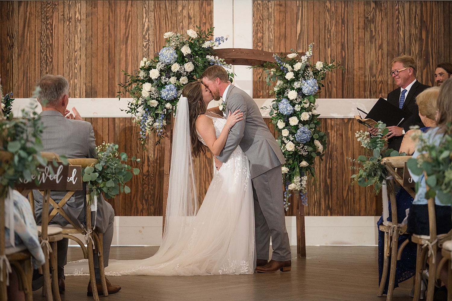 bride and groom first kiss