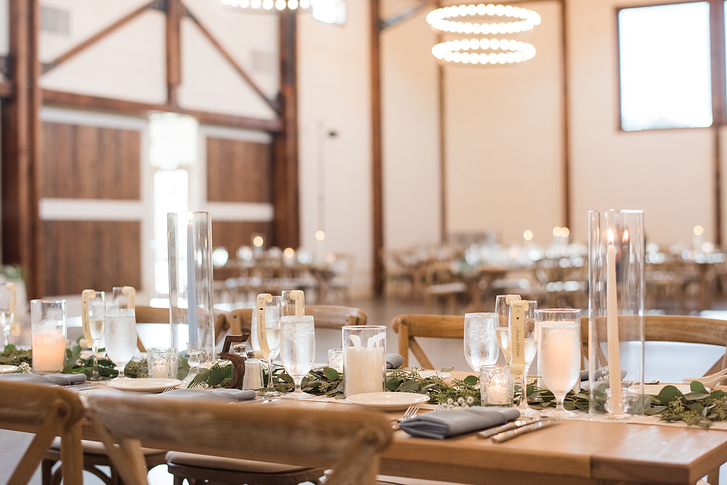 reception tablescape with farmhouse tables and blue linens