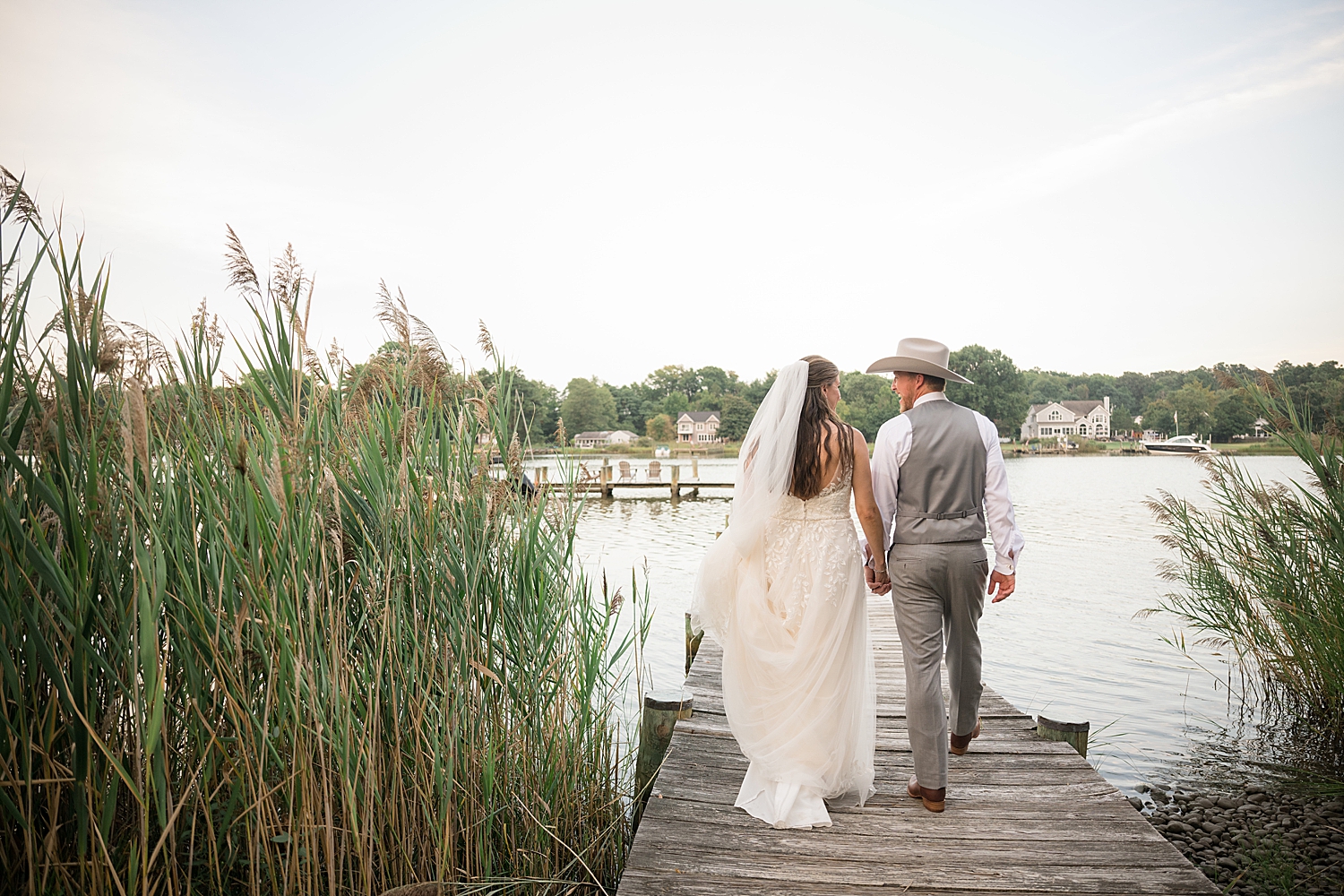 bride and groom portrait on pier