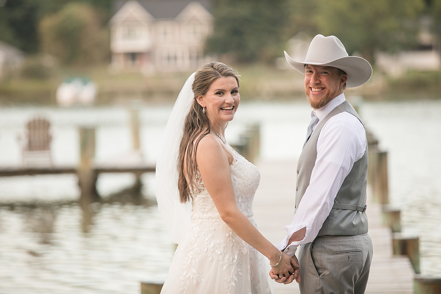 bride and groom portrait on pier