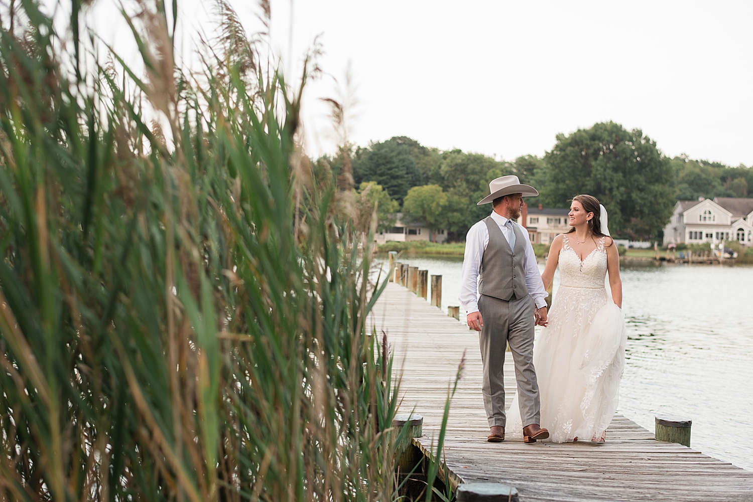 bride and groom portrait on pier