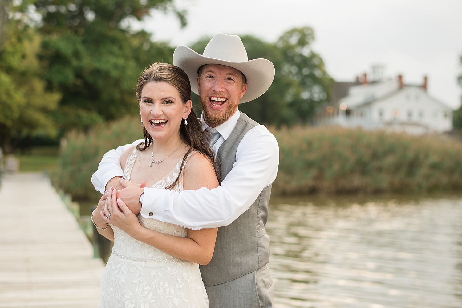 bride and groom portrait on pier