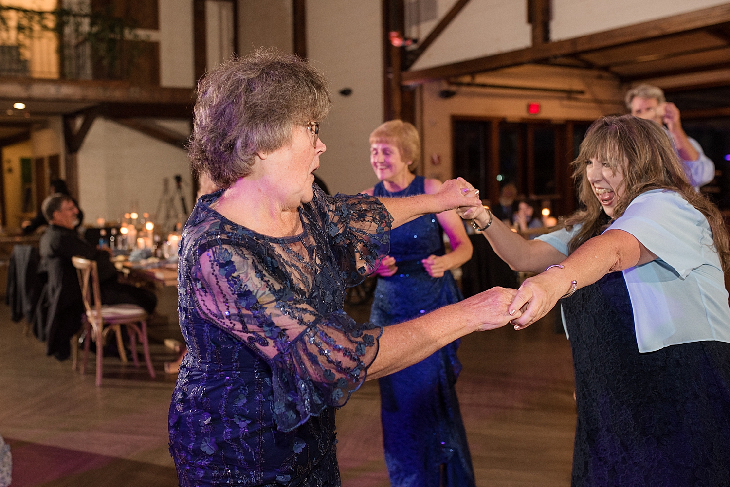 candid wedding guests dancing