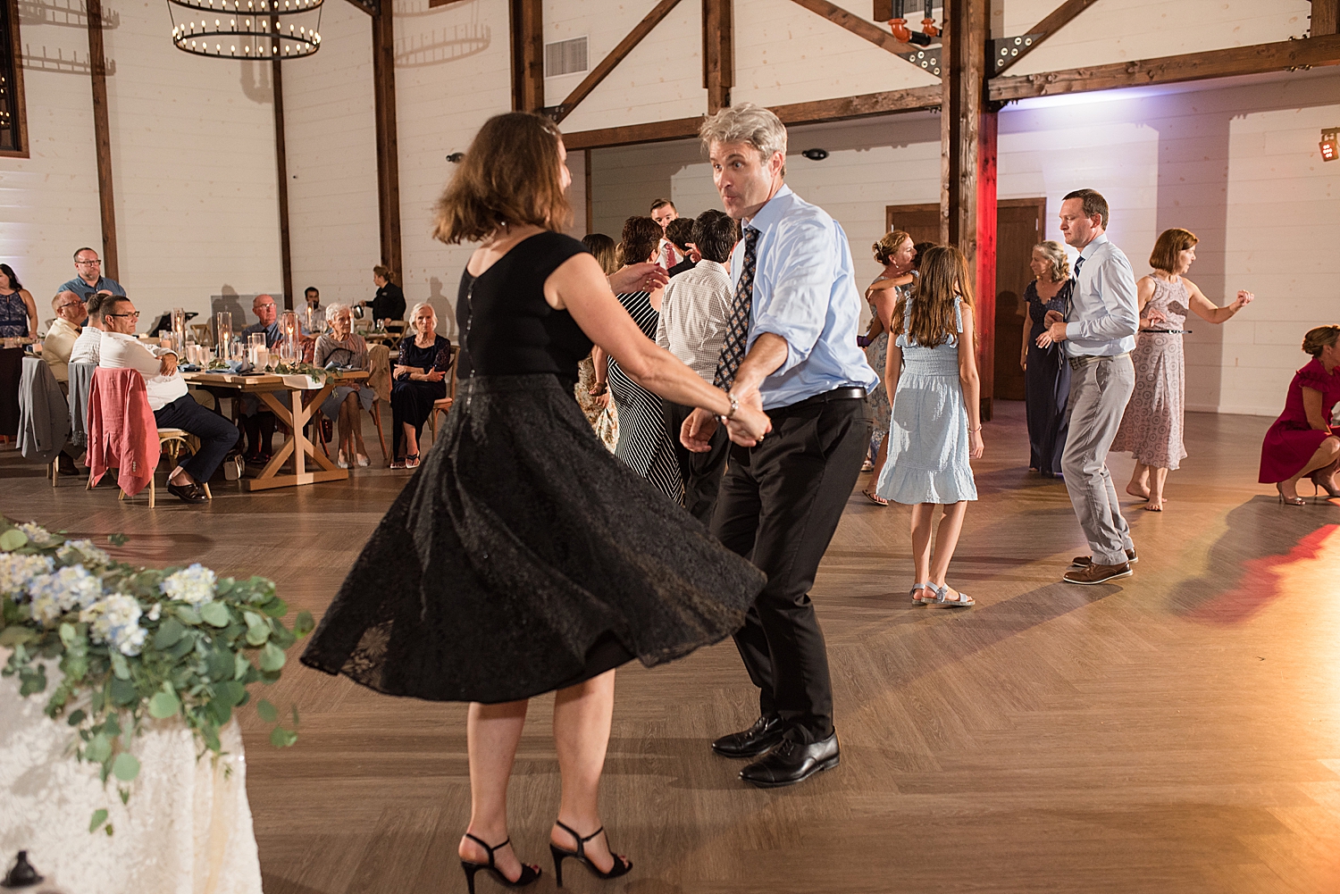 candid wedding guests dancing