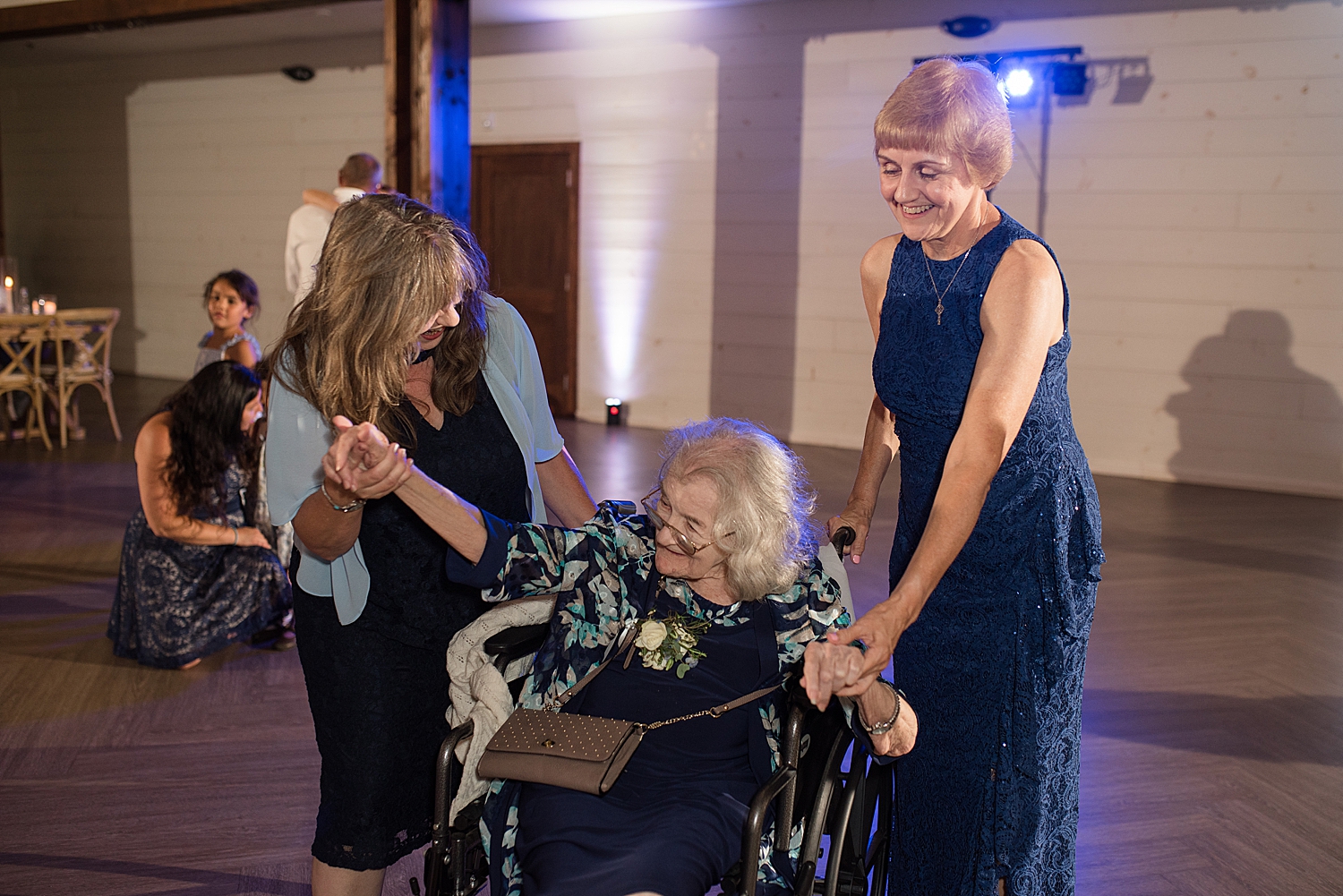 candid wedding guests dancing