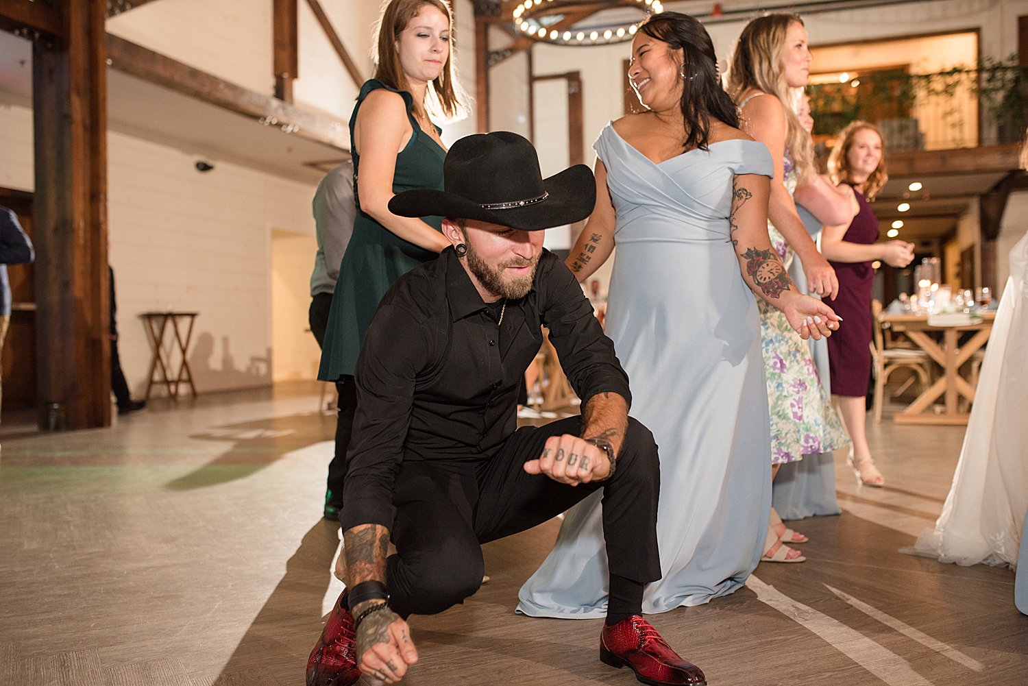 candid wedding guests dancing