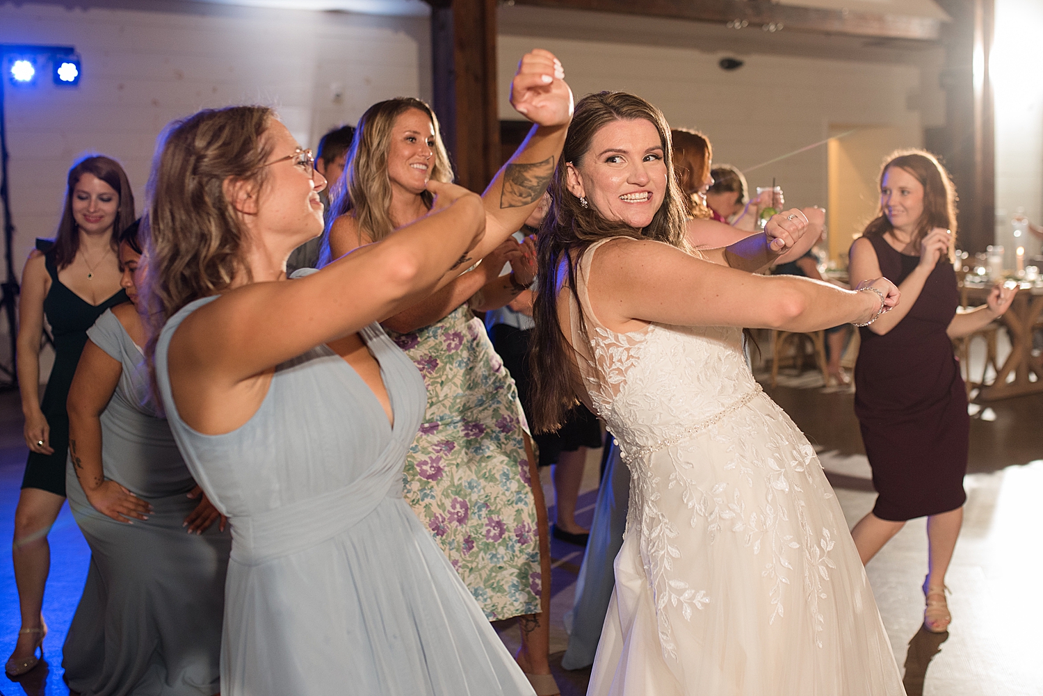 candid wedding guests dancing wobble