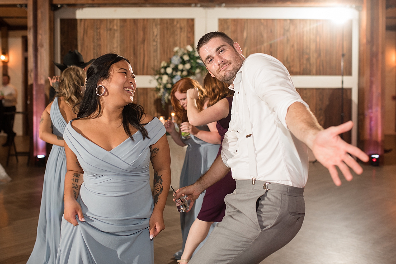 candid wedding guests dancing