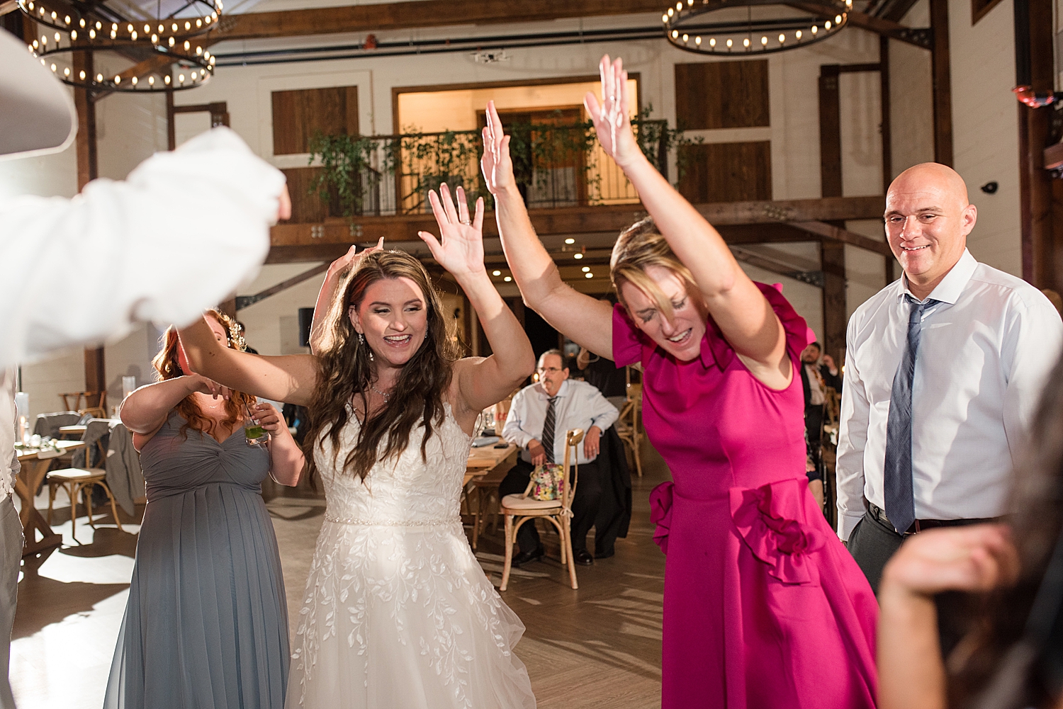 candid wedding guests dancing