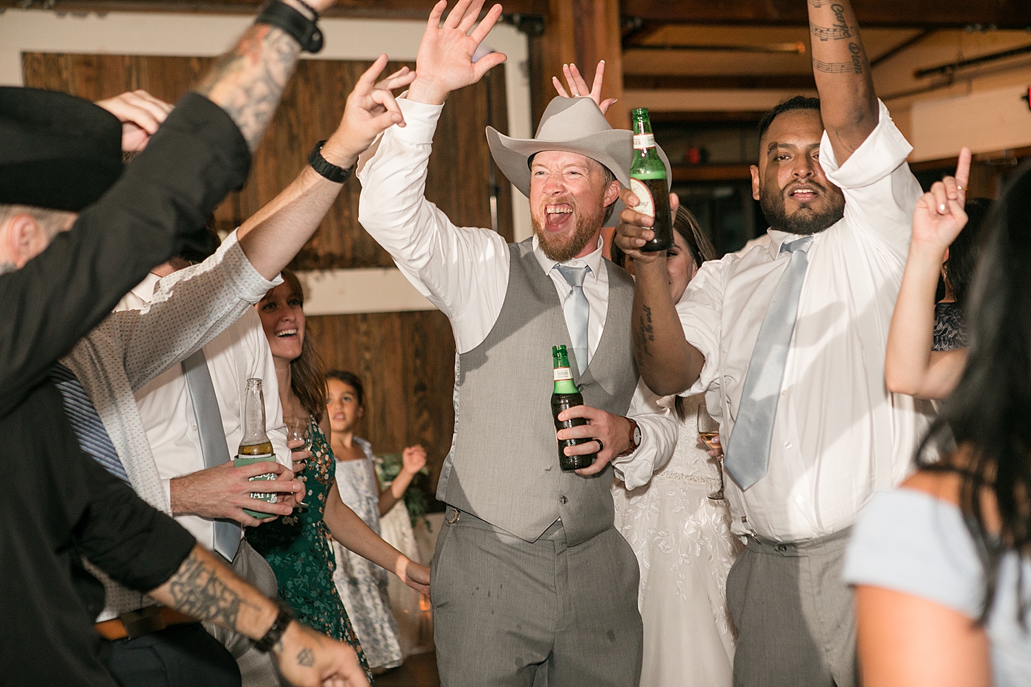 candid wedding guests dancing