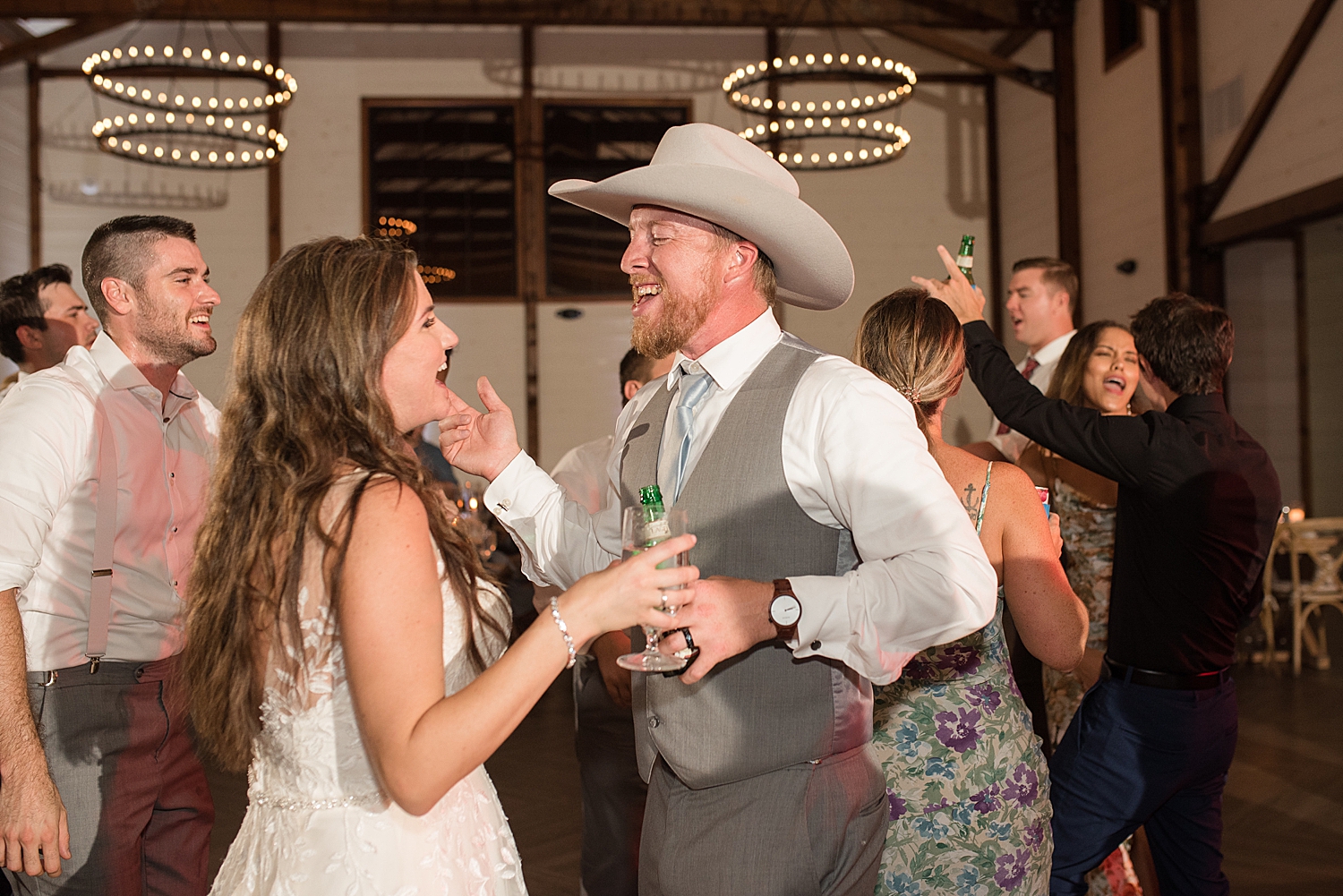 candid wedding guests dancing