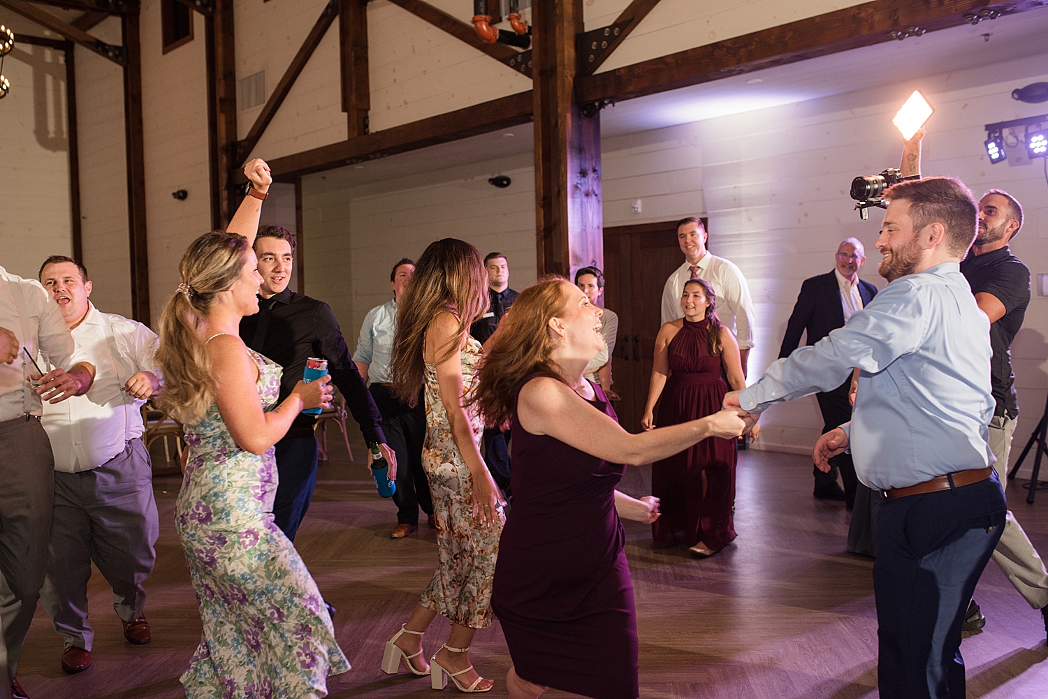 candid wedding guests dancing