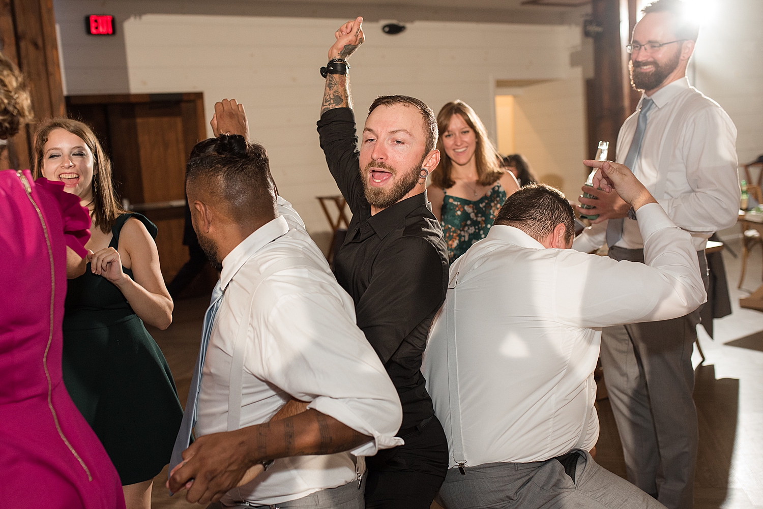 candid wedding guests dancing