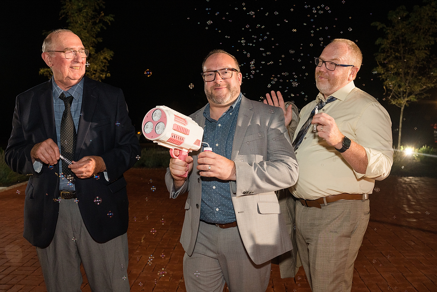 friends holding bubble gun