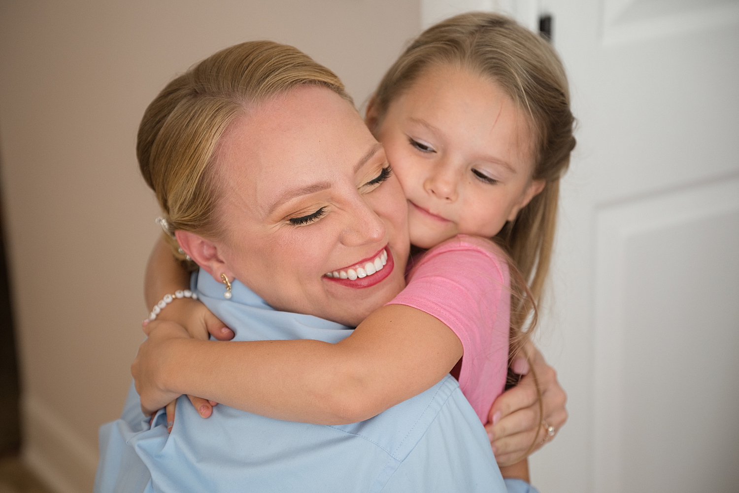 bride hugging step daughter