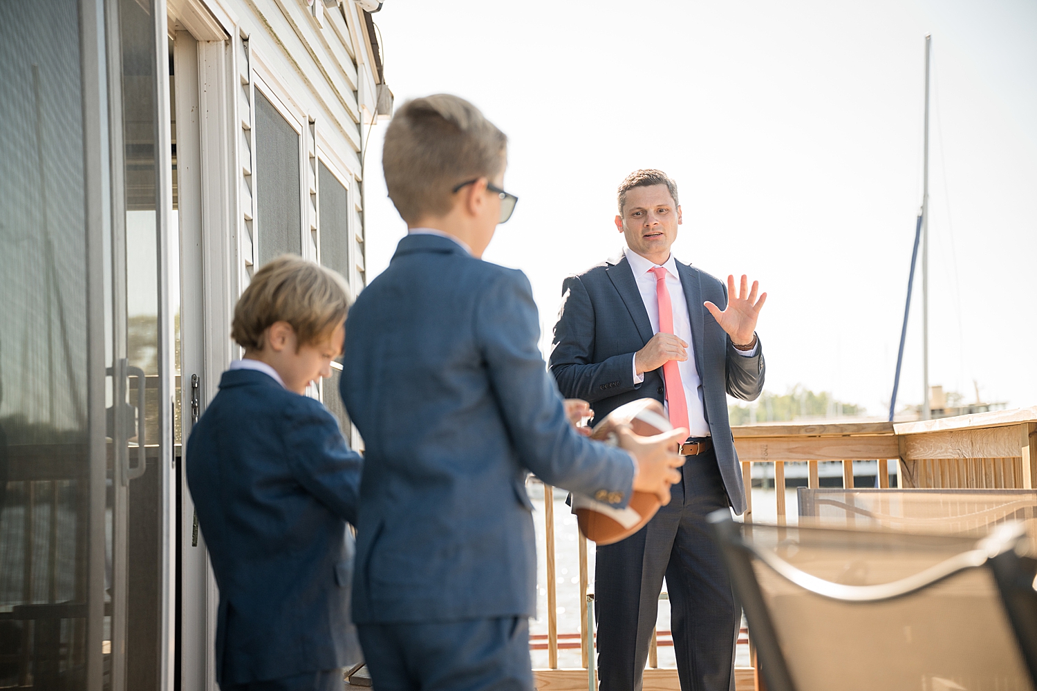 groom hanging with sons