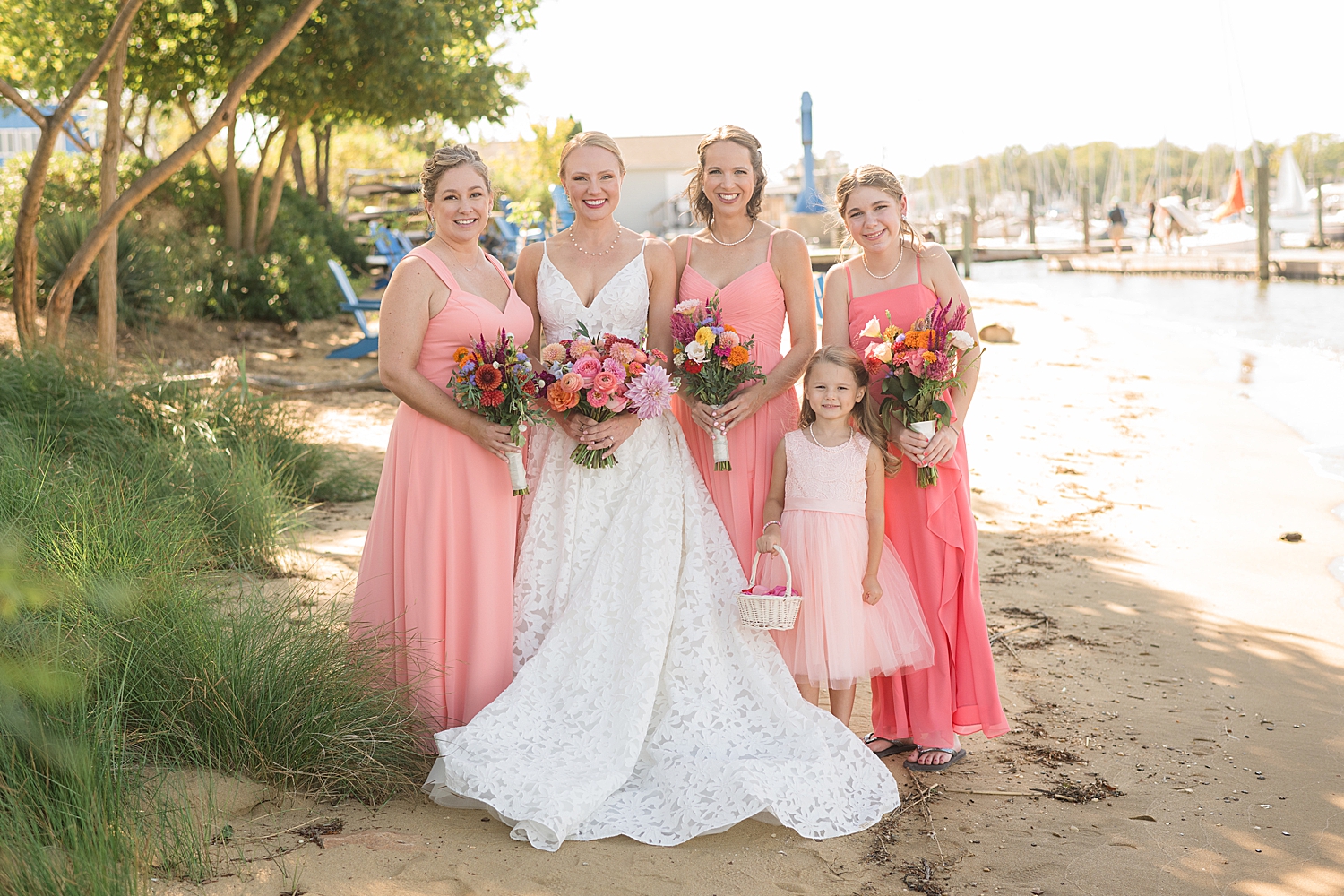 bride and bridesmaids portrait vibrant pink bouquets