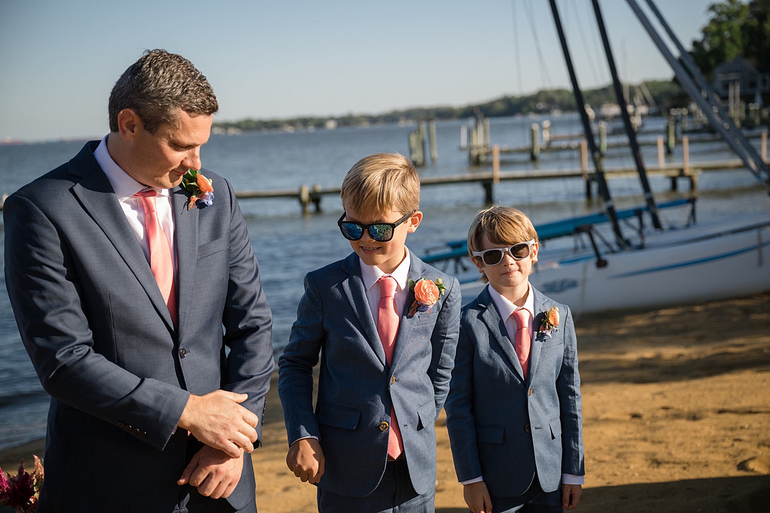 groom with best men at end of aisle