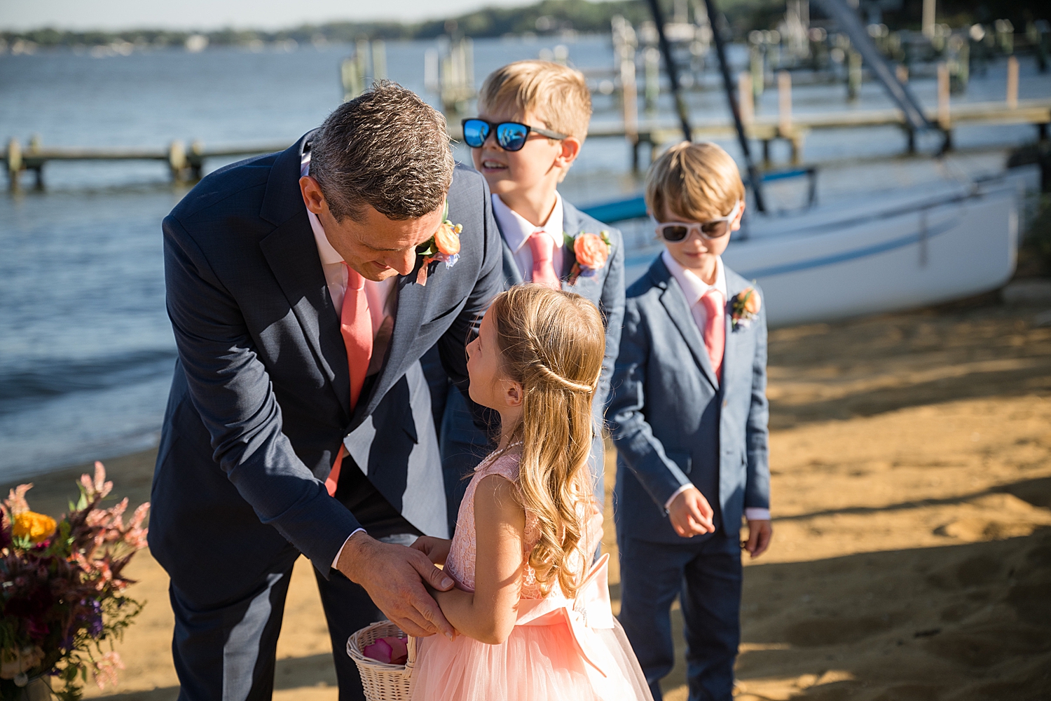 groom greets flower girl