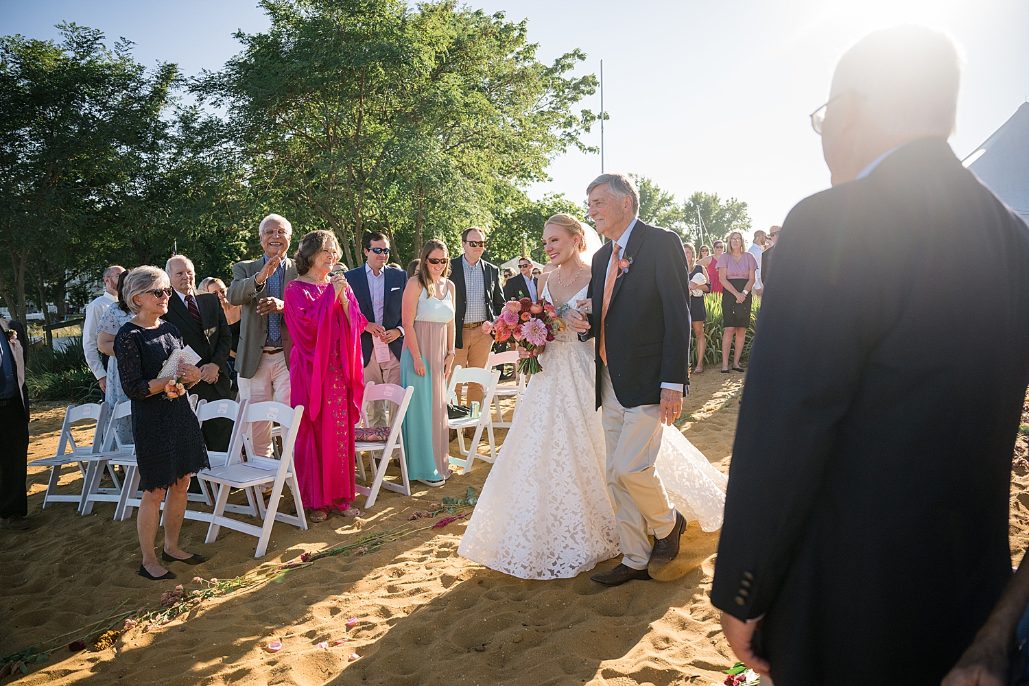 bride walks down ceremony aisle