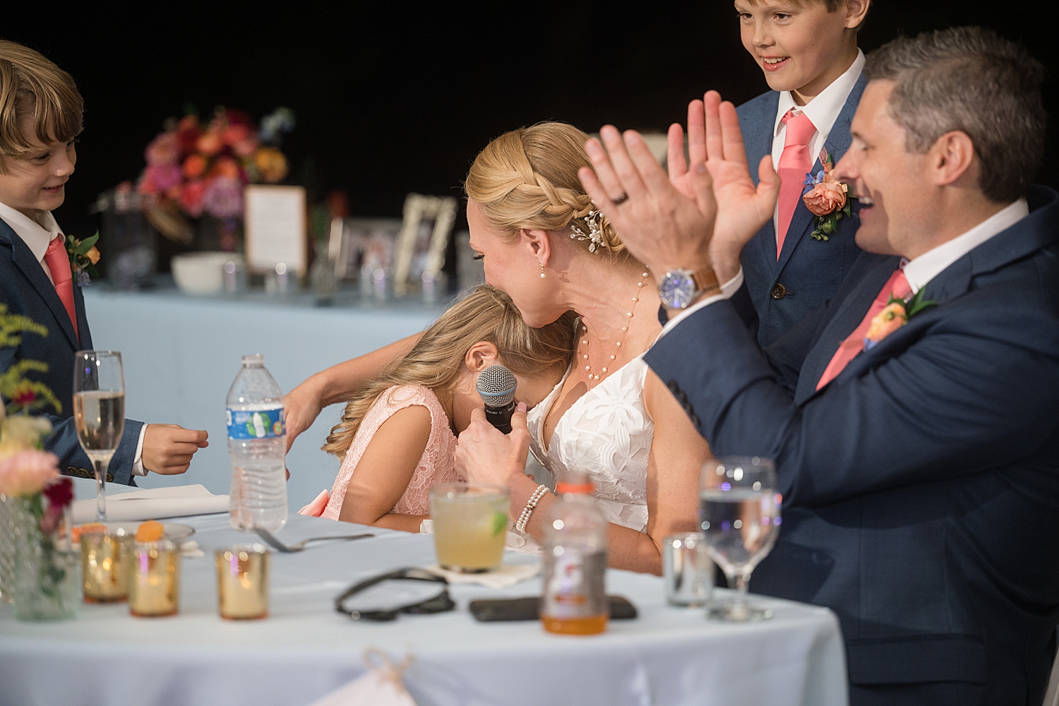 bride embracing step daughter after toast